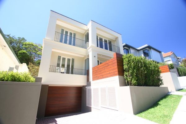 This home is a new build with a classic modern architectural design. It is a three story home with four bedrooms, three bathrooms, separate living areas, four car garage and a wine cellar.